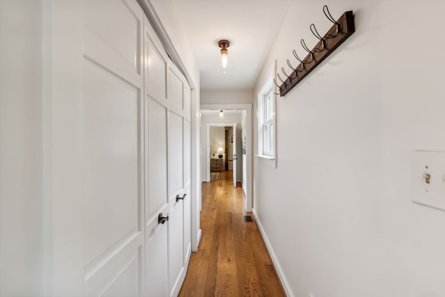 corridor featuring hardwood / wood-style flooring