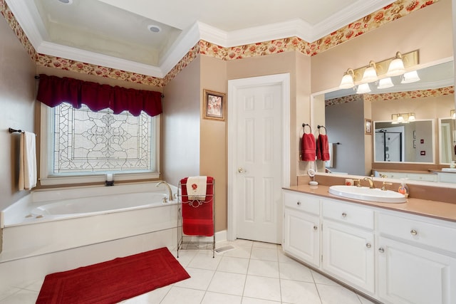 bathroom with ornamental molding, a bathing tub, vanity, and tile patterned floors