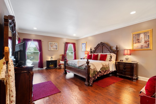 bedroom featuring wood-type flooring, multiple windows, and ornamental molding