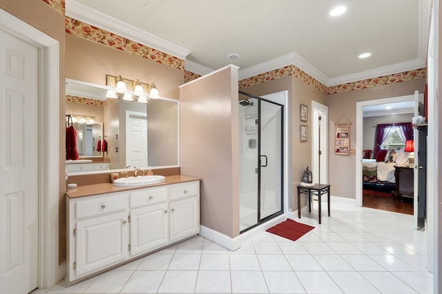 bathroom featuring a shower with shower door, vanity, tile patterned floors, and crown molding