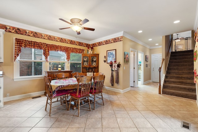 dining space featuring ornamental molding, ceiling fan, and light tile patterned flooring