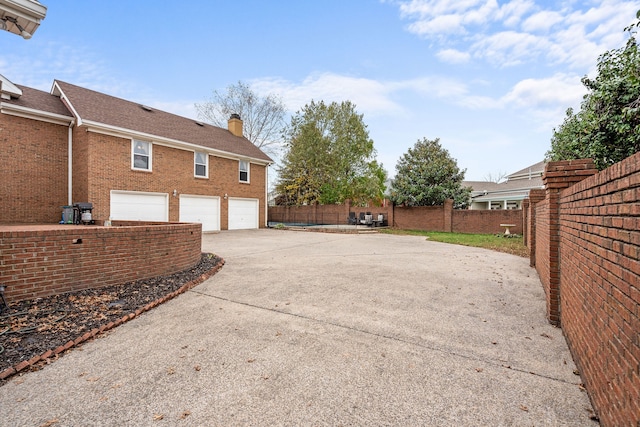 view of side of property with a garage