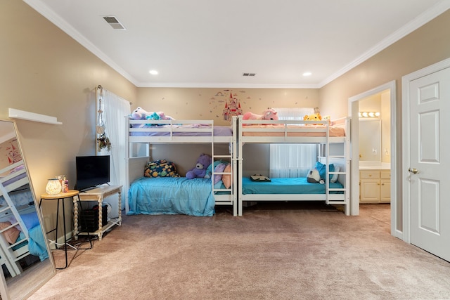 carpeted bedroom featuring ensuite bathroom and ornamental molding