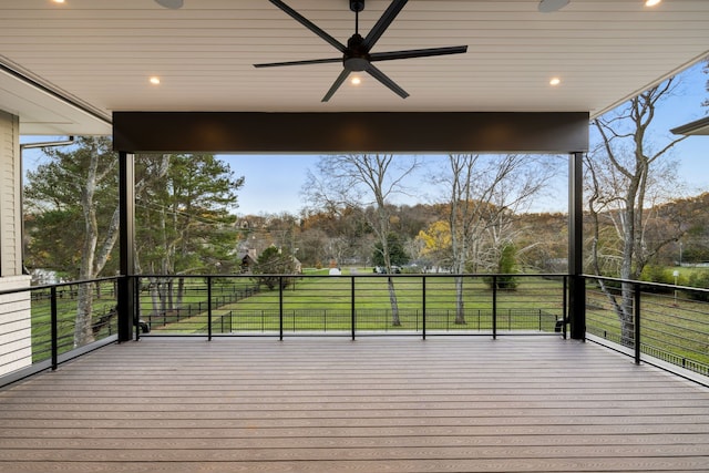 wooden deck featuring ceiling fan