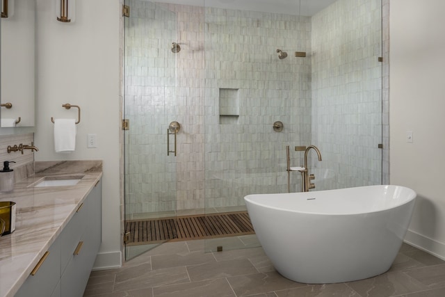 bathroom featuring plus walk in shower and vanity