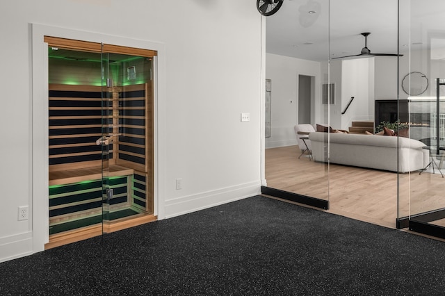 unfurnished living room featuring hardwood / wood-style floors and ceiling fan