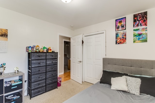 carpeted bedroom with a closet