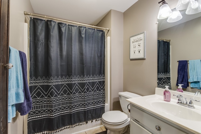 bathroom with tile patterned floors, vanity, and toilet