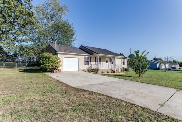 single story home featuring a front yard, a garage, and a porch