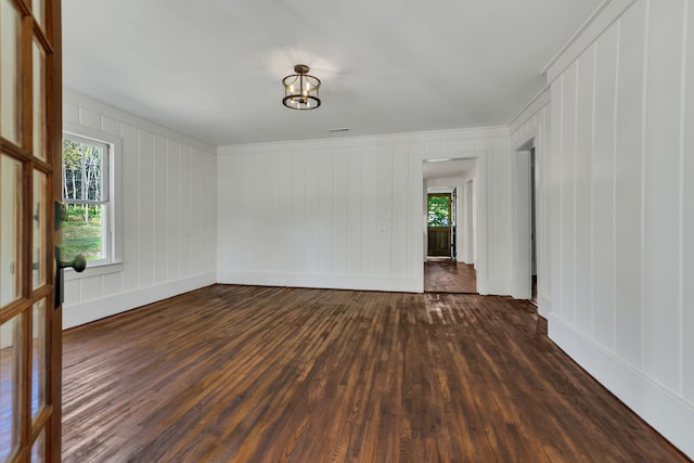 spare room with dark hardwood / wood-style floors