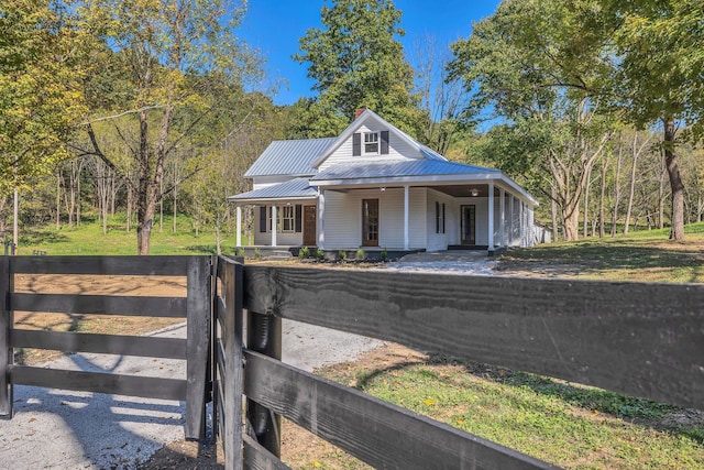 country-style home featuring a porch