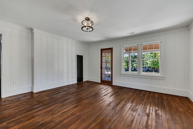 spare room featuring dark hardwood / wood-style flooring