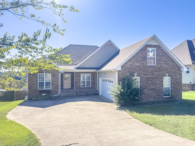 view of front of property featuring a garage and a front yard