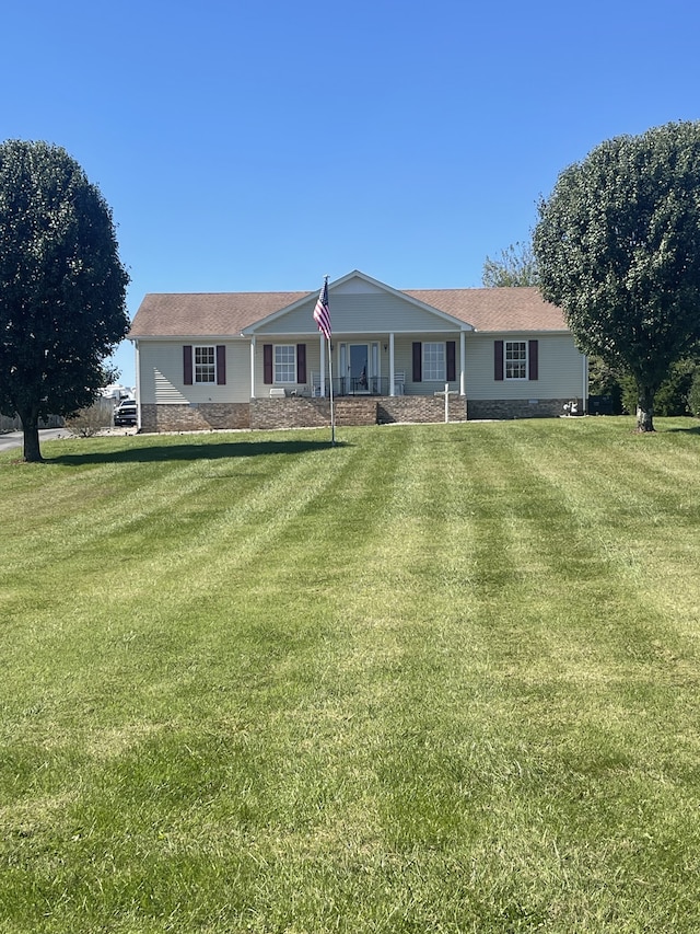 ranch-style house with a front lawn