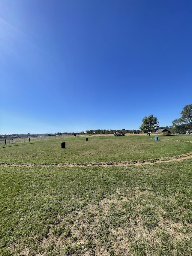 view of yard with a rural view