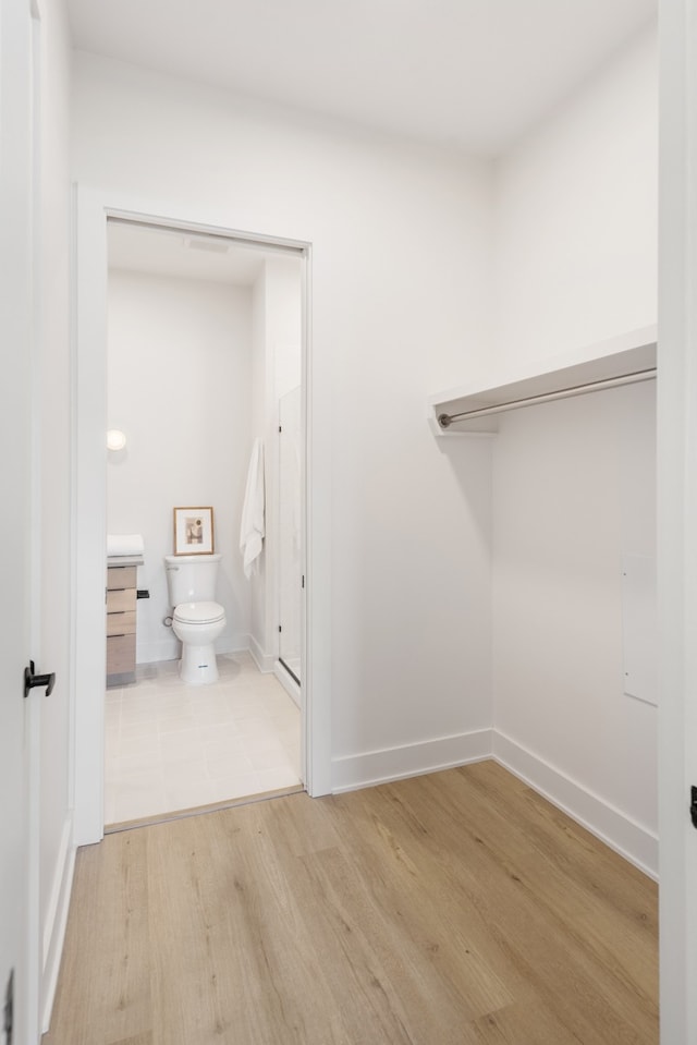 bathroom featuring hardwood / wood-style floors, vanity, and toilet