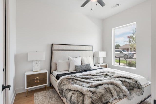 bedroom with hardwood / wood-style flooring and ceiling fan