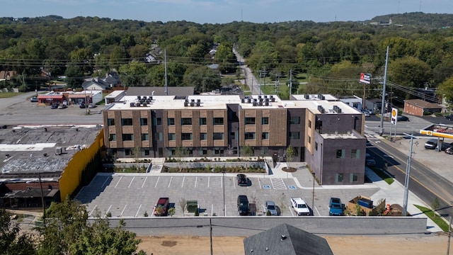 drone / aerial view featuring a forest view