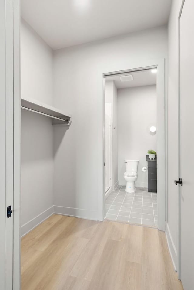 spacious closet with wood finished floors