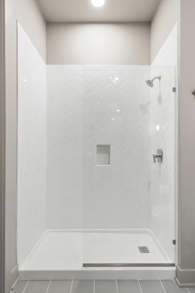 full bath with a shower stall