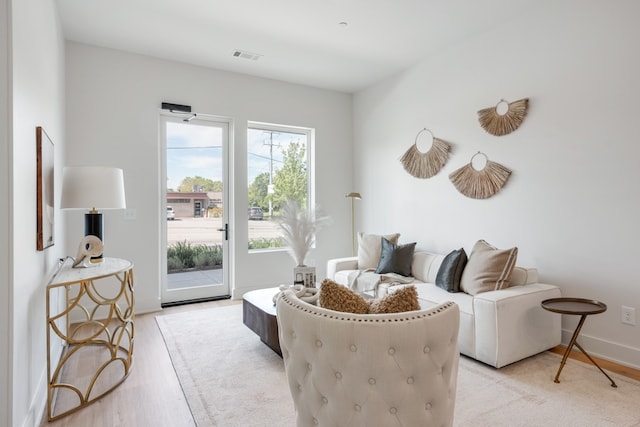 sitting room featuring light hardwood / wood-style flooring