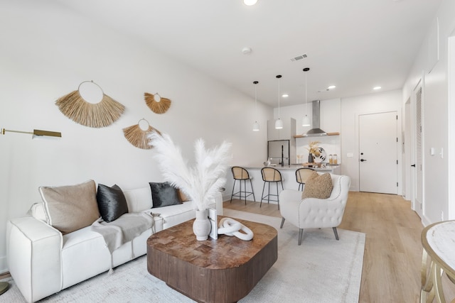 living room with light hardwood / wood-style floors