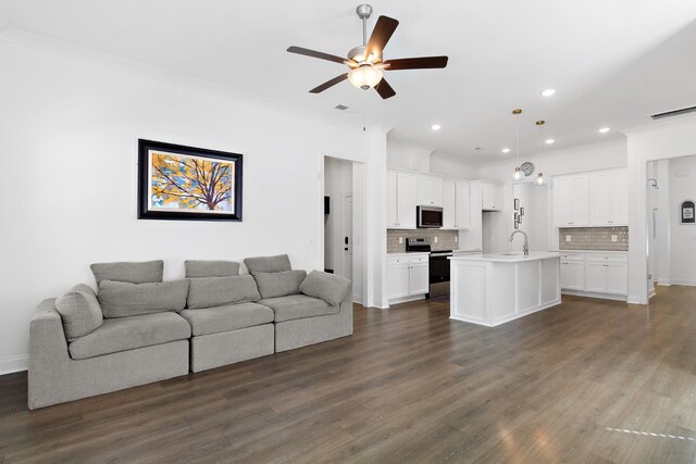 living room with ornamental molding, ceiling fan, sink, and dark hardwood / wood-style flooring