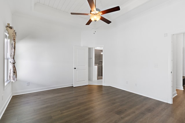 empty room featuring ceiling fan and dark hardwood / wood-style floors