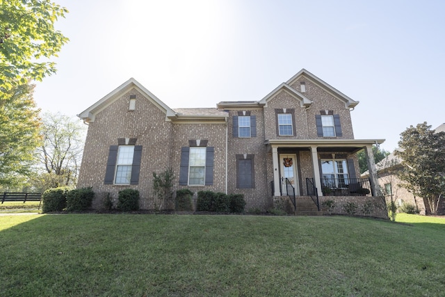 view of front of home with a front lawn and covered porch