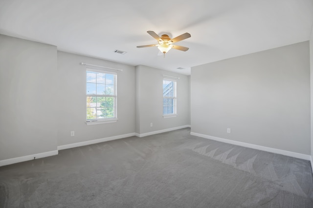 carpeted empty room with ceiling fan