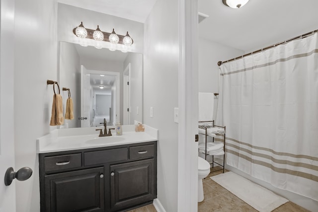 bathroom featuring a shower with curtain, tile patterned floors, vanity, and toilet