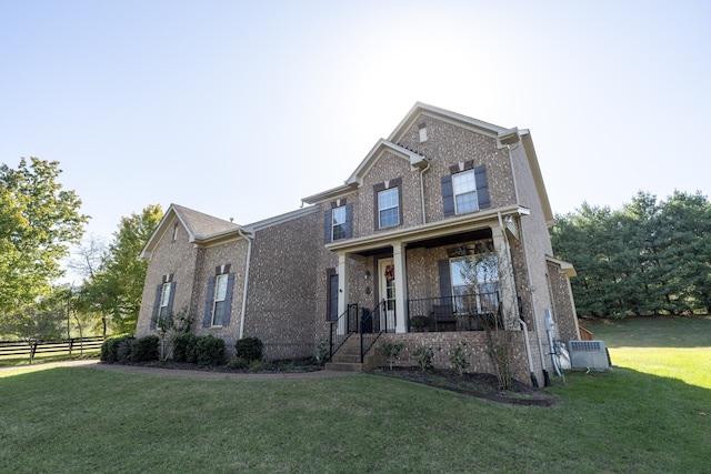 front of property featuring a porch and a front lawn