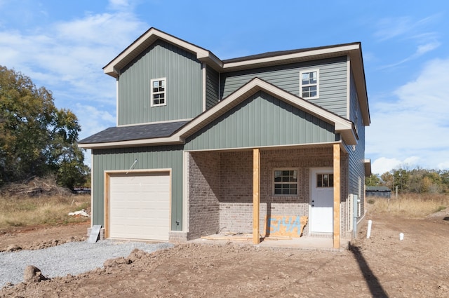 view of front of house with a garage and covered porch