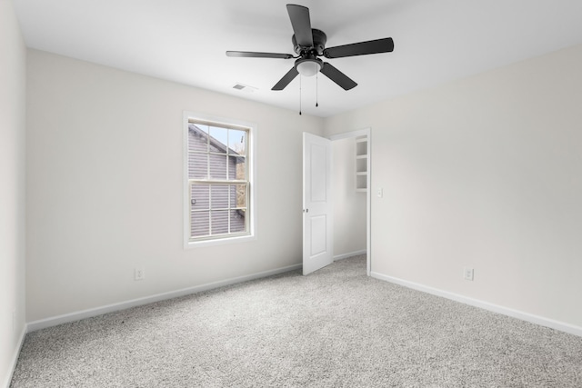 unfurnished bedroom with ceiling fan and carpet floors