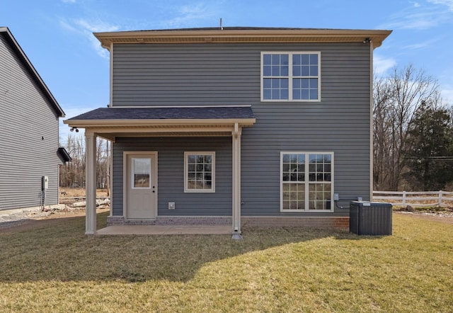 back of house with a patio, central AC unit, fence, and a lawn