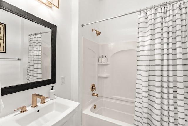 bathroom with sink and shower / tub combo