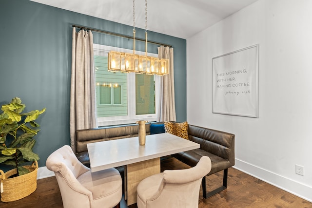 dining room featuring breakfast area and dark hardwood / wood-style floors