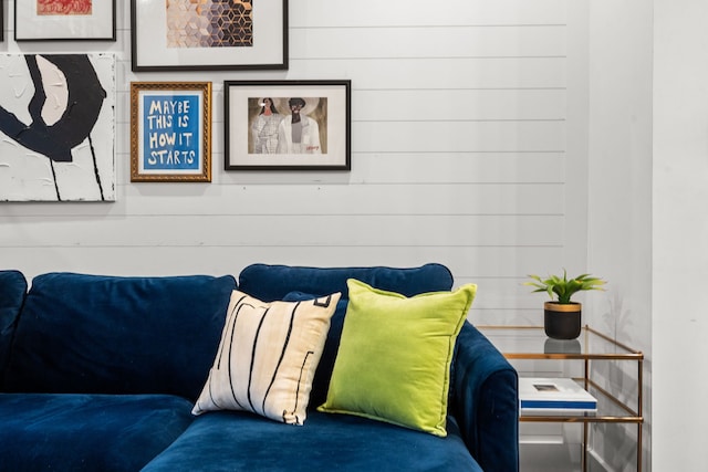 living room featuring wood walls