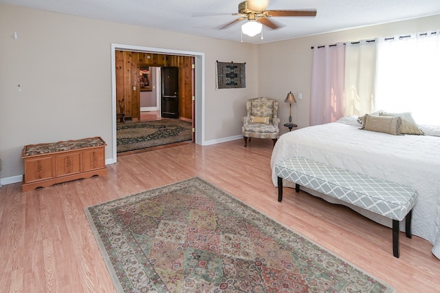 bedroom featuring hardwood / wood-style flooring and ceiling fan