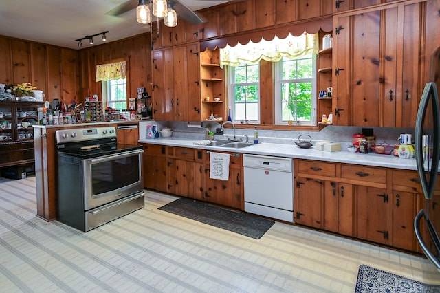 kitchen with ceiling fan, sink, dishwasher, plenty of natural light, and stainless steel range with electric cooktop