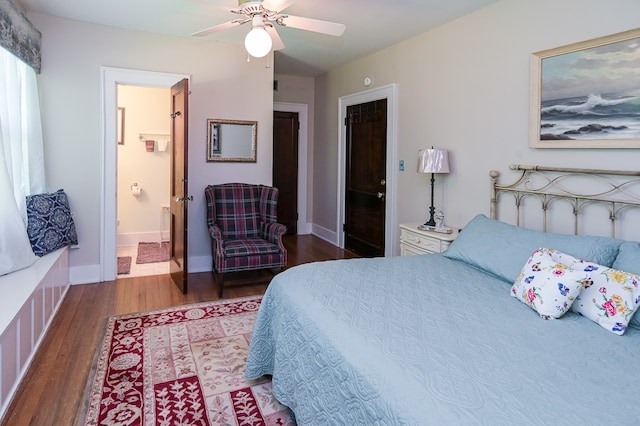 bedroom featuring a closet, ceiling fan, hardwood / wood-style floors, and ensuite bath