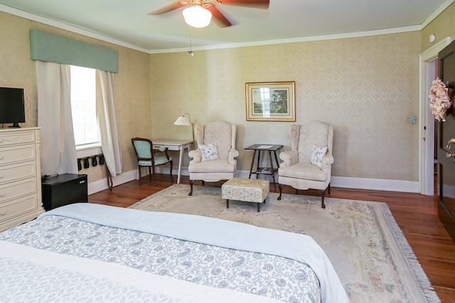 bedroom featuring hardwood / wood-style flooring, ceiling fan, and crown molding