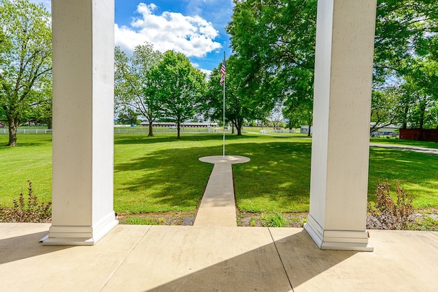 view of property's community featuring a lawn