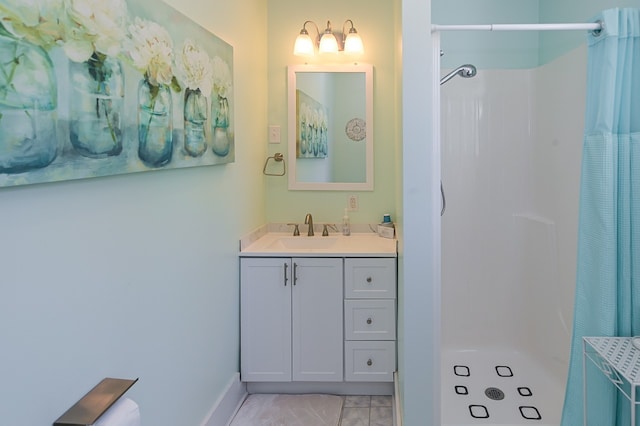 bathroom featuring vanity and curtained shower