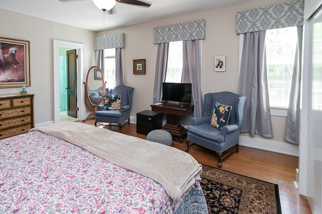 bedroom with ceiling fan and hardwood / wood-style flooring