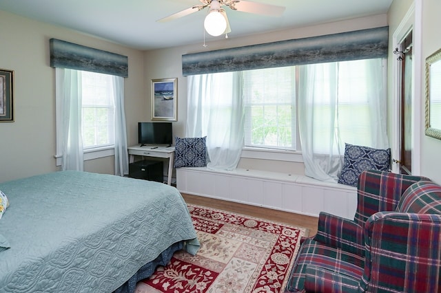 bedroom featuring hardwood / wood-style flooring and ceiling fan