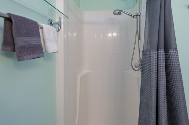 bathroom with a shower with curtain