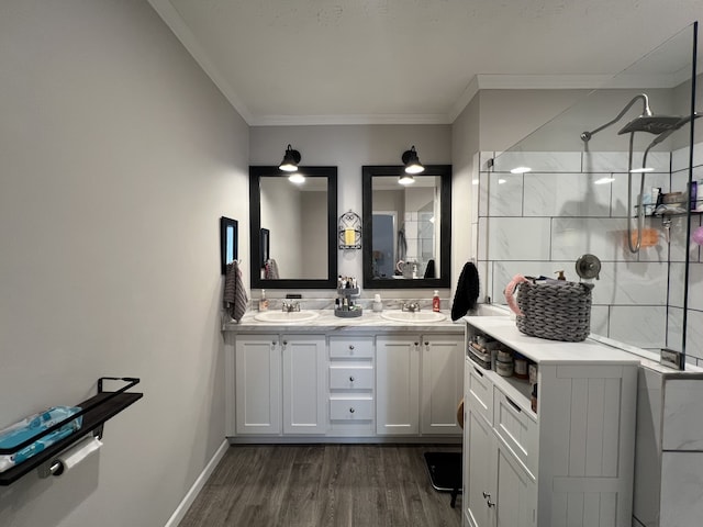 bathroom with vanity, a shower, crown molding, and hardwood / wood-style floors