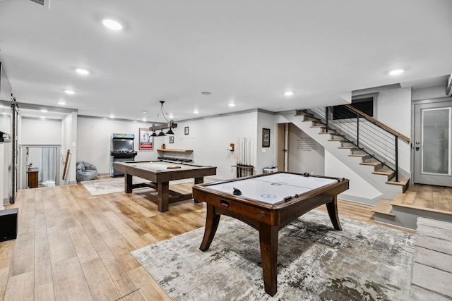 game room featuring billiards, light wood-type flooring, and ornamental molding