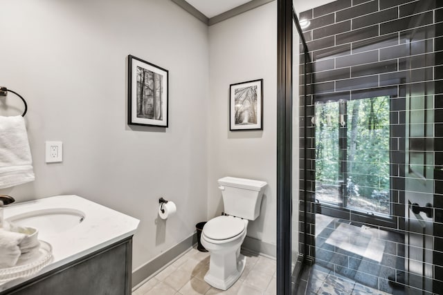 bathroom with crown molding, tile patterned floors, vanity, and toilet